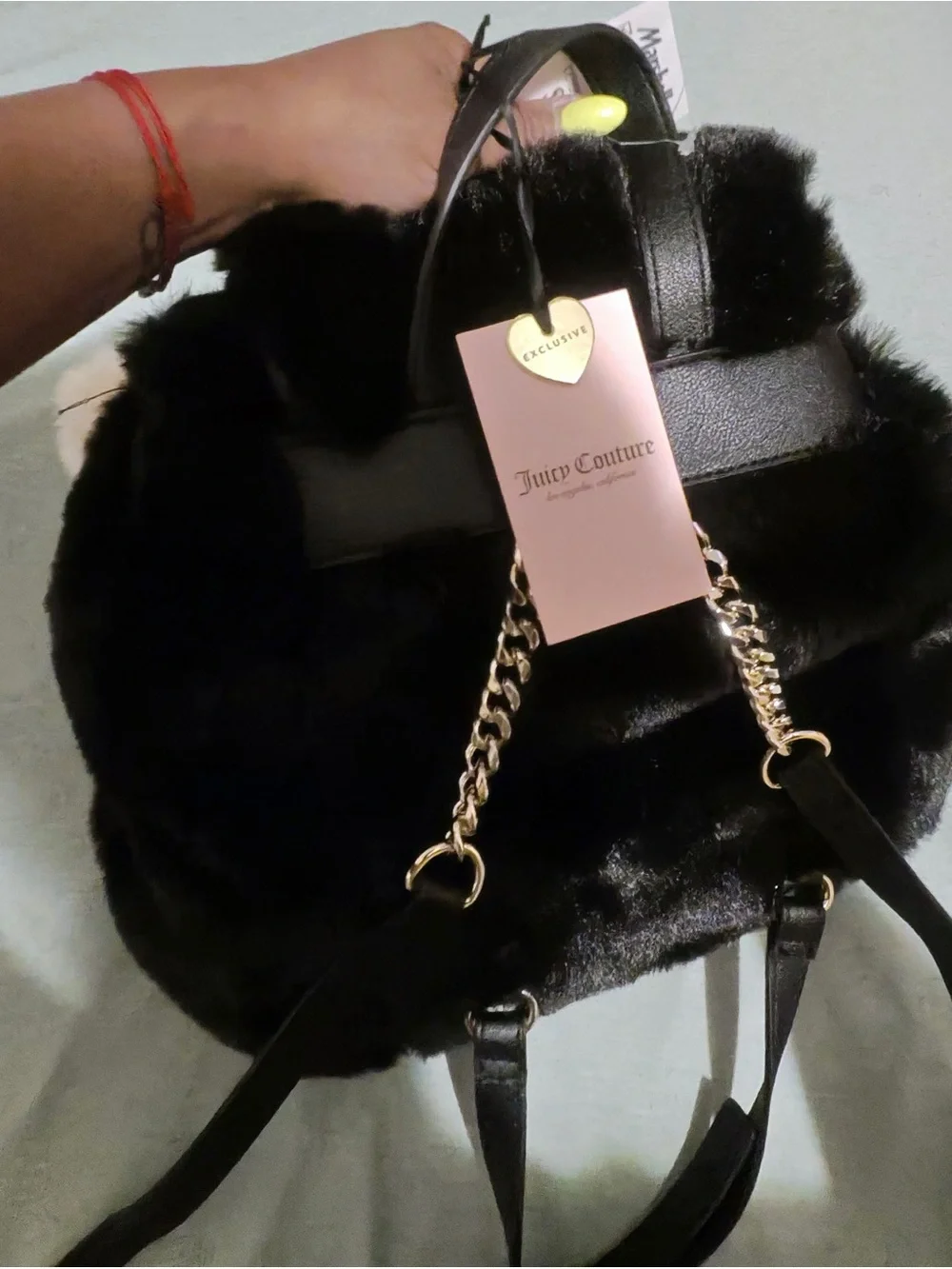 Juicy Couture Dreamy Divas black faux fur backpack with drawstring closure